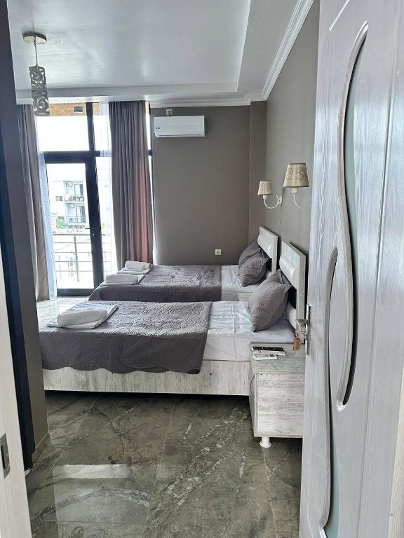 Postel nebo postele na pokoji v ubytování Hotel black sea