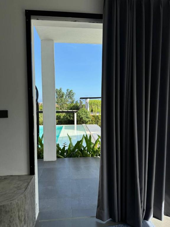 an open door to a patio with a view at Villa Valeria in Ungasan