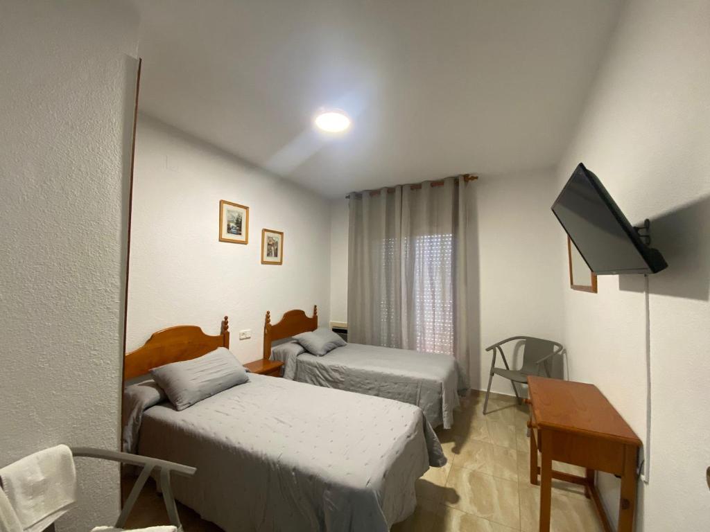 TV a/nebo společenská místnost v ubytování Hotel Muñoz
