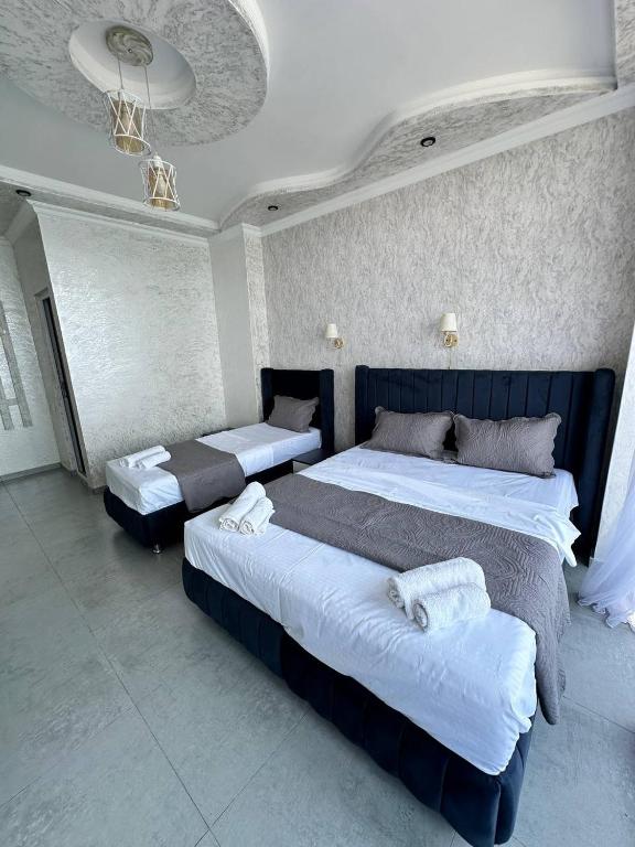 Postel nebo postele na pokoji v ubytování Hotel black sea