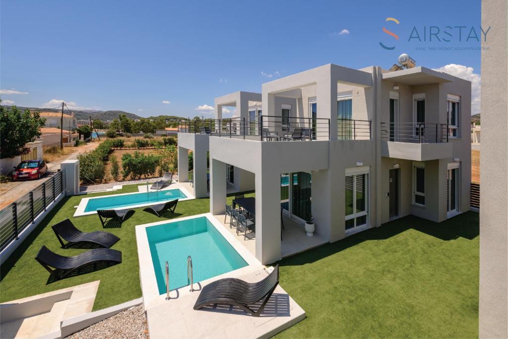 Πισίνα στο ή κοντά στο Komos Villas Airport by Airstay