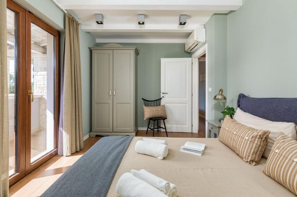 Postel nebo postele na pokoji v ubytování Villa Vira
