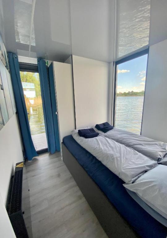Posteľ alebo postele v izbe v ubytovaní AquaHouse Zamkowe