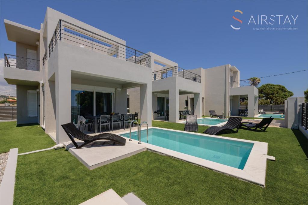 Πισίνα στο ή κοντά στο Komos Villas Airport by Airstay