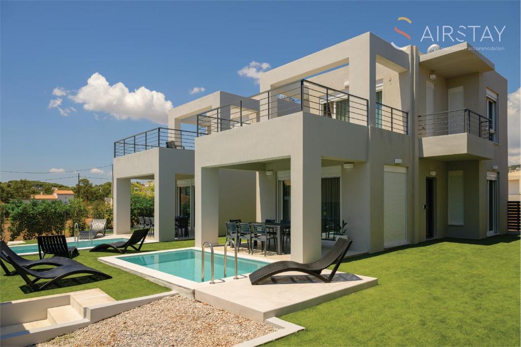 Πισίνα στο ή κοντά στο Komos Villas Airport by Airstay