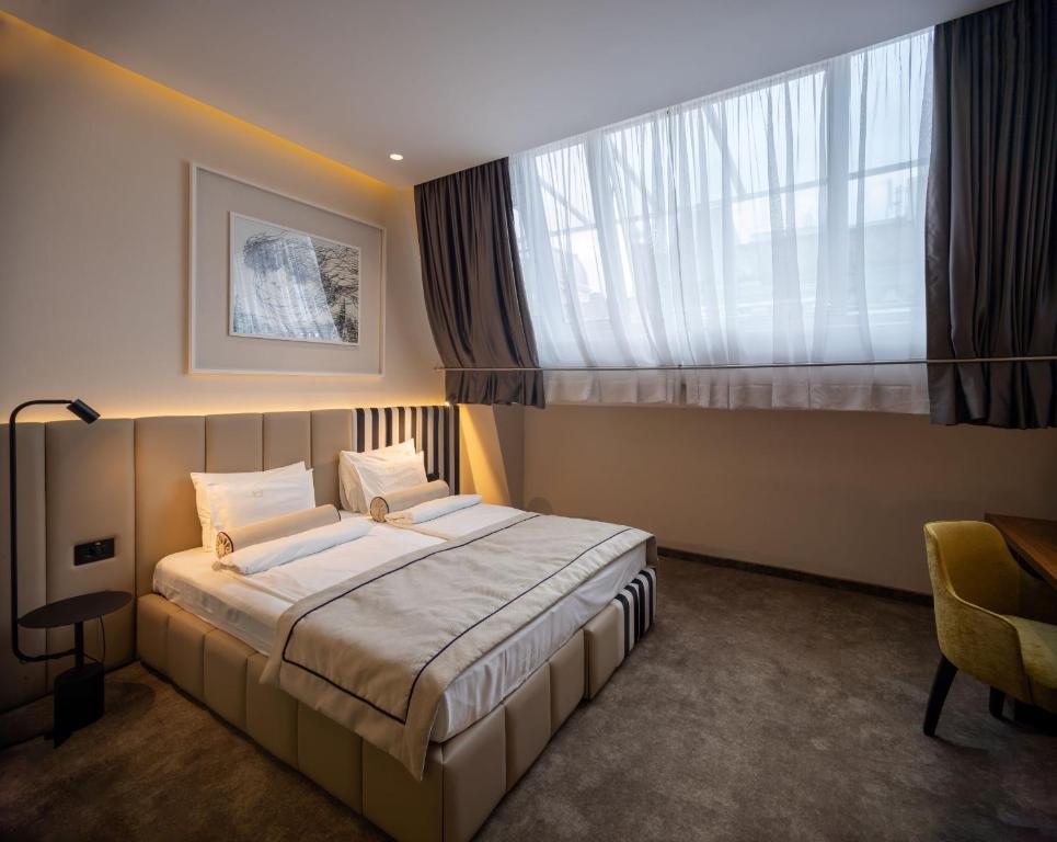 Postel nebo postele na pokoji v ubytování Maison Royale