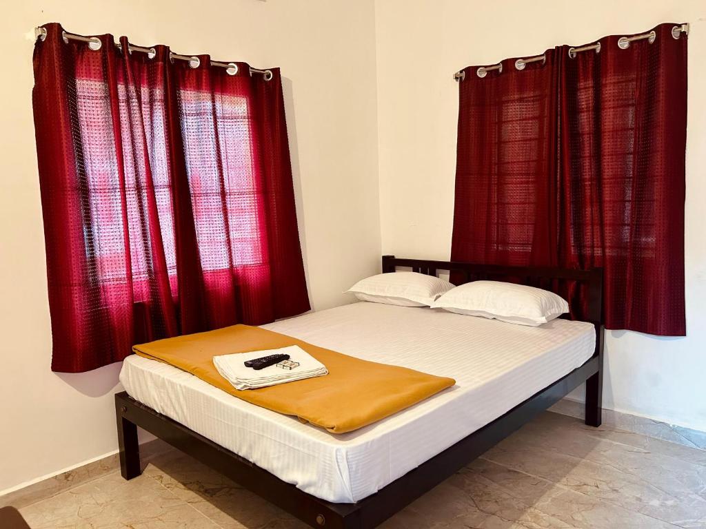 Postel nebo postele na pokoji v ubytování De villa Breeze Beach Inn