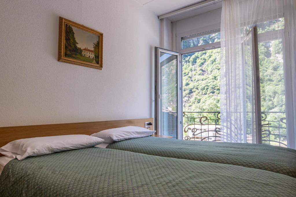 Postel nebo postele na pokoji v ubytování Albergo Stazione