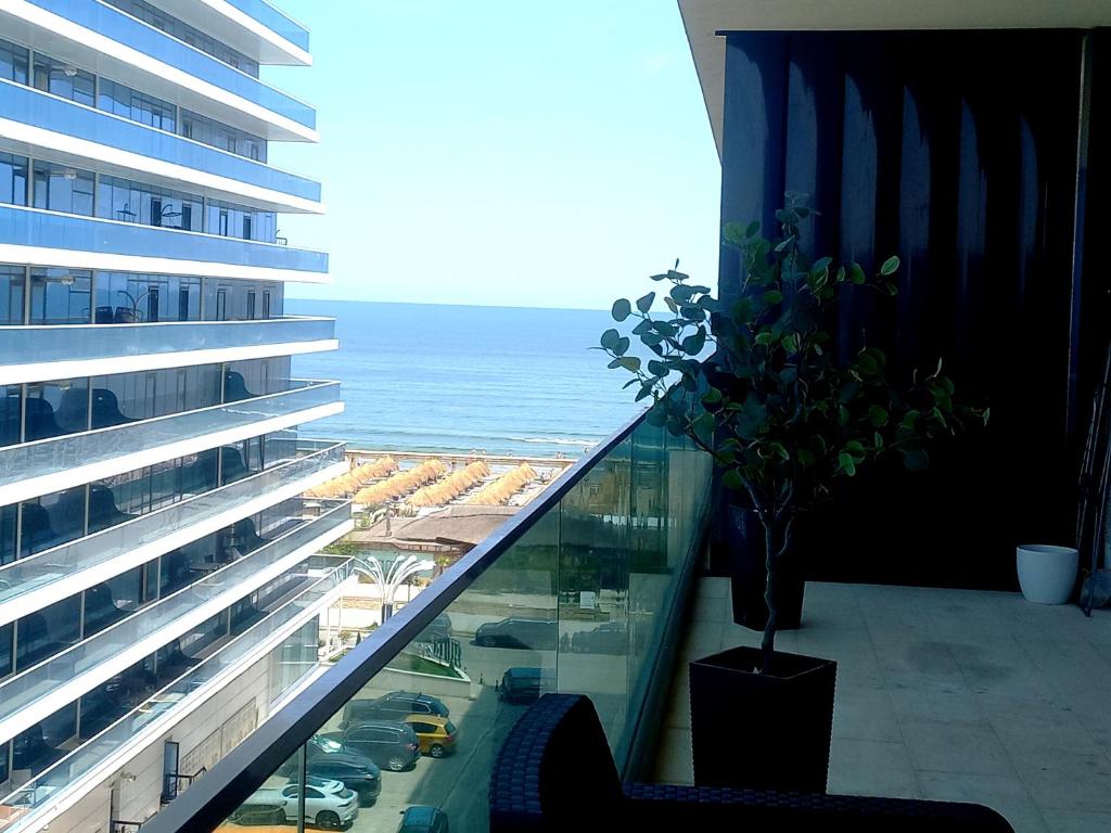 a balcony of a building with a view of the ocean at Black Sea Luxury Apartament - Mamaia Nord Beachfront in Mamaia Nord