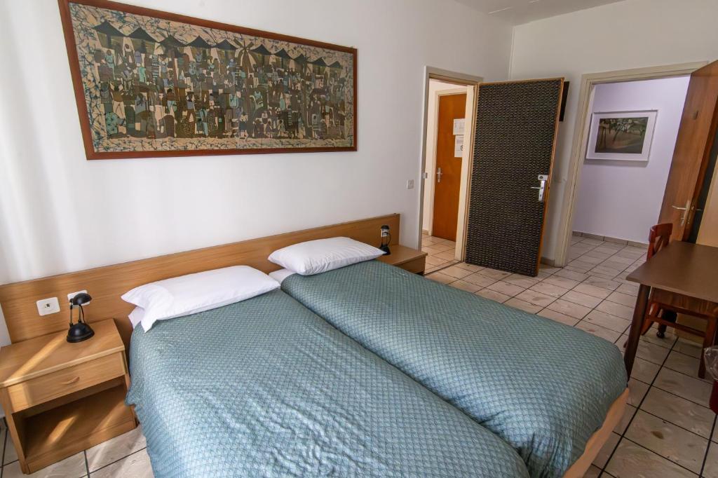 Postel nebo postele na pokoji v ubytování Albergo Stazione
