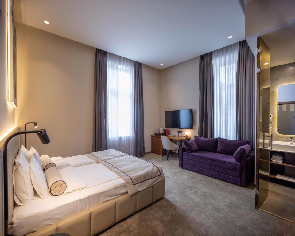 Postel nebo postele na pokoji v ubytování Maison Royale
