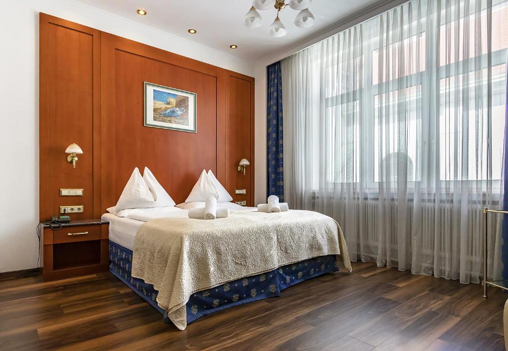 Postel nebo postele na pokoji v ubytování Hotel Corvinus Vienna - Newly Renovated