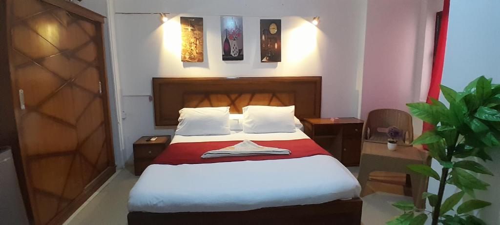 Postel nebo postele na pokoji v ubytování ALShawarbi Plaza Hotel