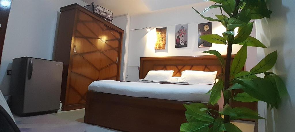 Postel nebo postele na pokoji v ubytování ALShawarbi Plaza Hotel