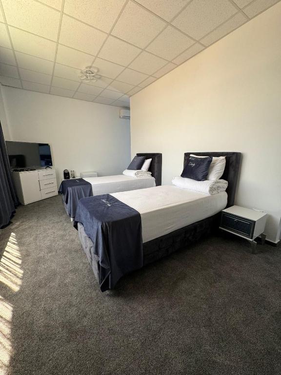 Postel nebo postele na pokoji v ubytování Hotel Daly