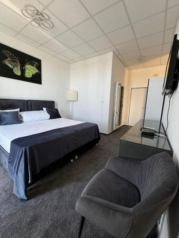 Postel nebo postele na pokoji v ubytování Hotel Daly