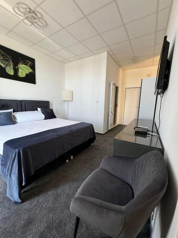 Postel nebo postele na pokoji v ubytování Hotel Daly