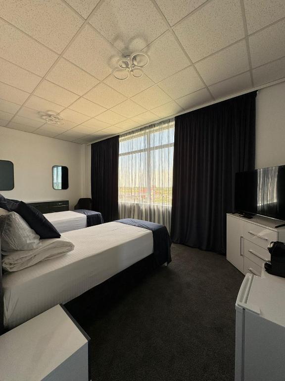 Postel nebo postele na pokoji v ubytování Hotel Daly