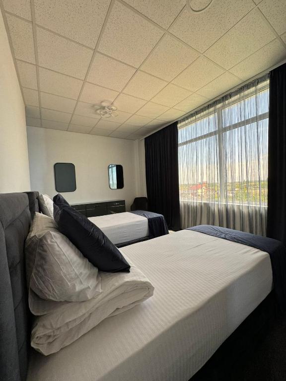 Postel nebo postele na pokoji v ubytování Hotel Daly