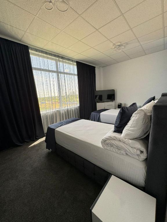 Postel nebo postele na pokoji v ubytování Hotel Daly