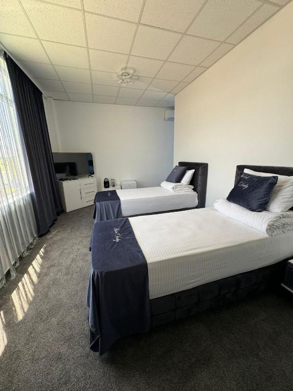 Postel nebo postele na pokoji v ubytování Hotel Daly