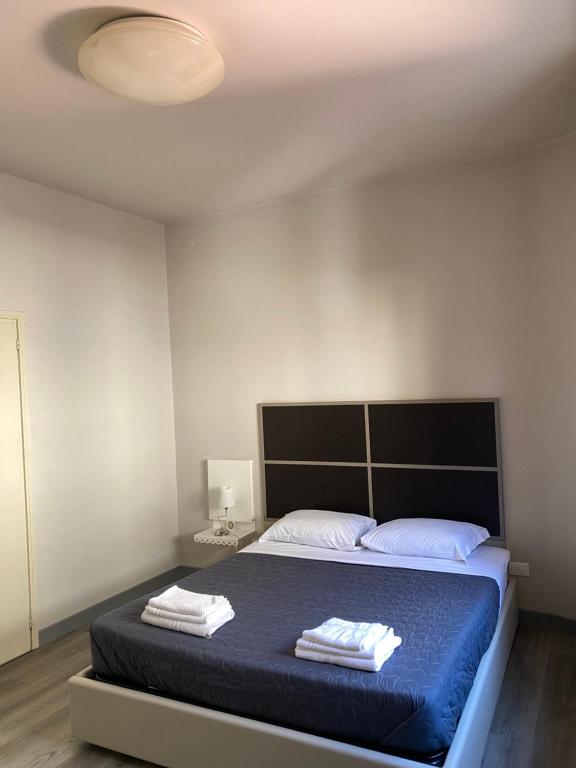 Postel nebo postele na pokoji v ubytování Albergo Leon D'Oro