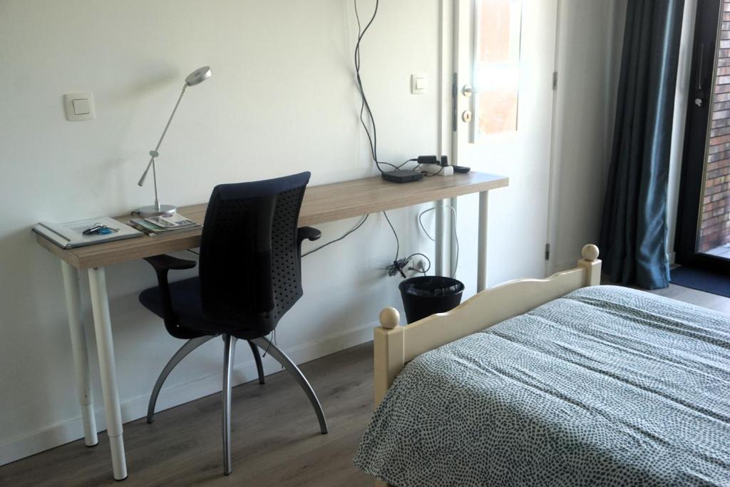 Postel nebo postele na pokoji v ubytování BnB Waterzicht