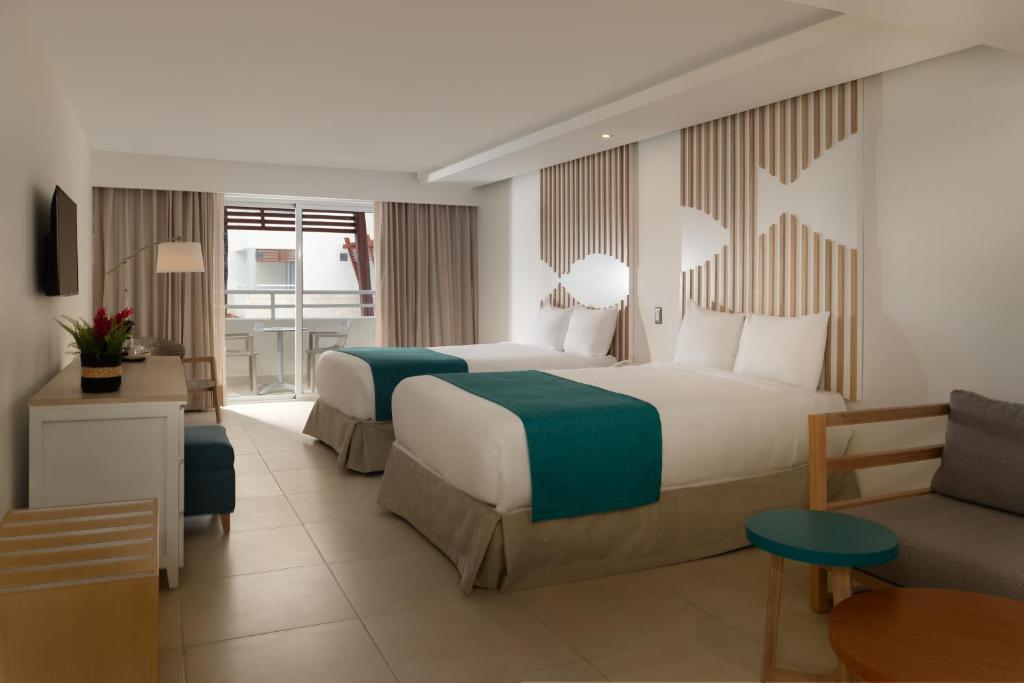 Postel nebo postele na pokoji v ubytování Select at Casa Marina Adults Only All Inclusive
