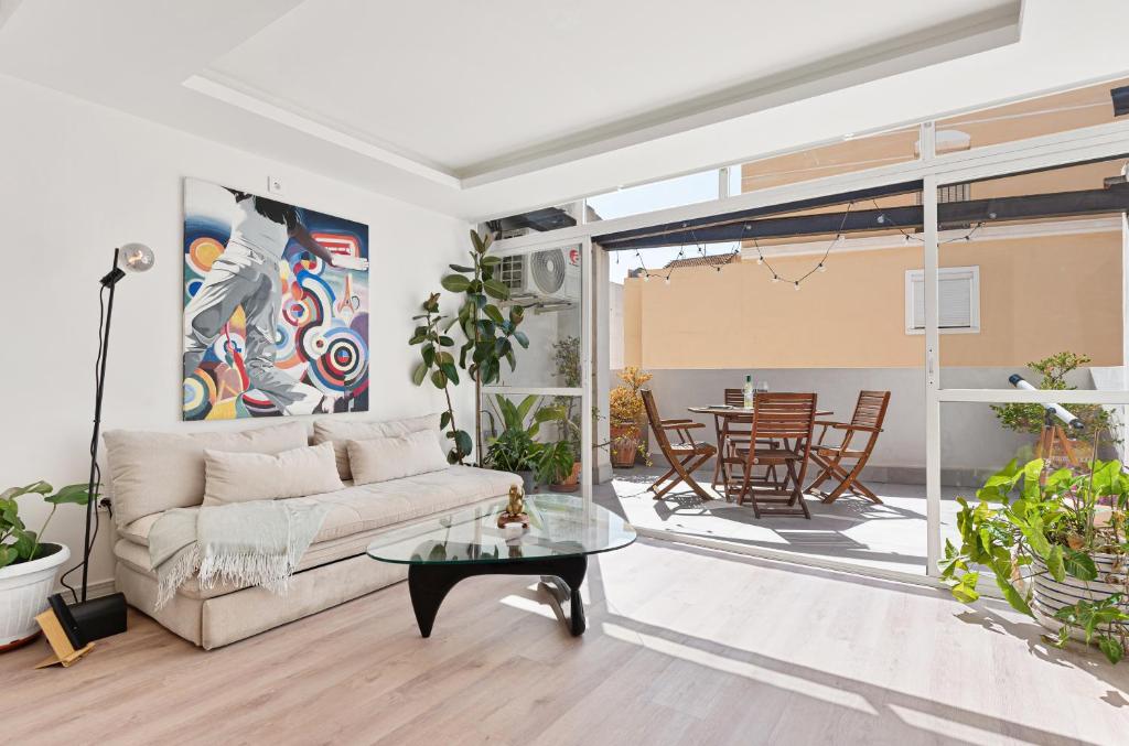 a living room with a couch and a table at Spiteri 12 by Pineapple Homes in Málaga
