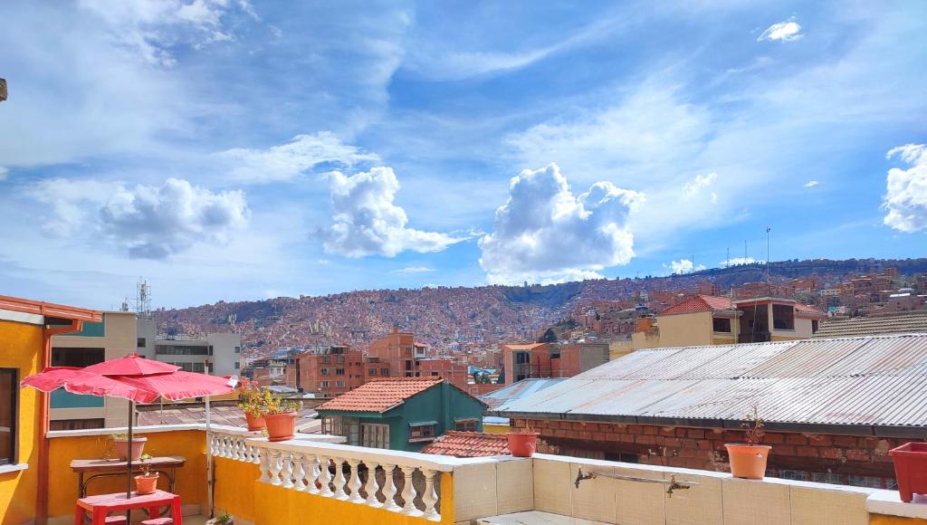 a balcony with a view of a city at Casa de Huéspedes "La Casa Bonita" in La Paz