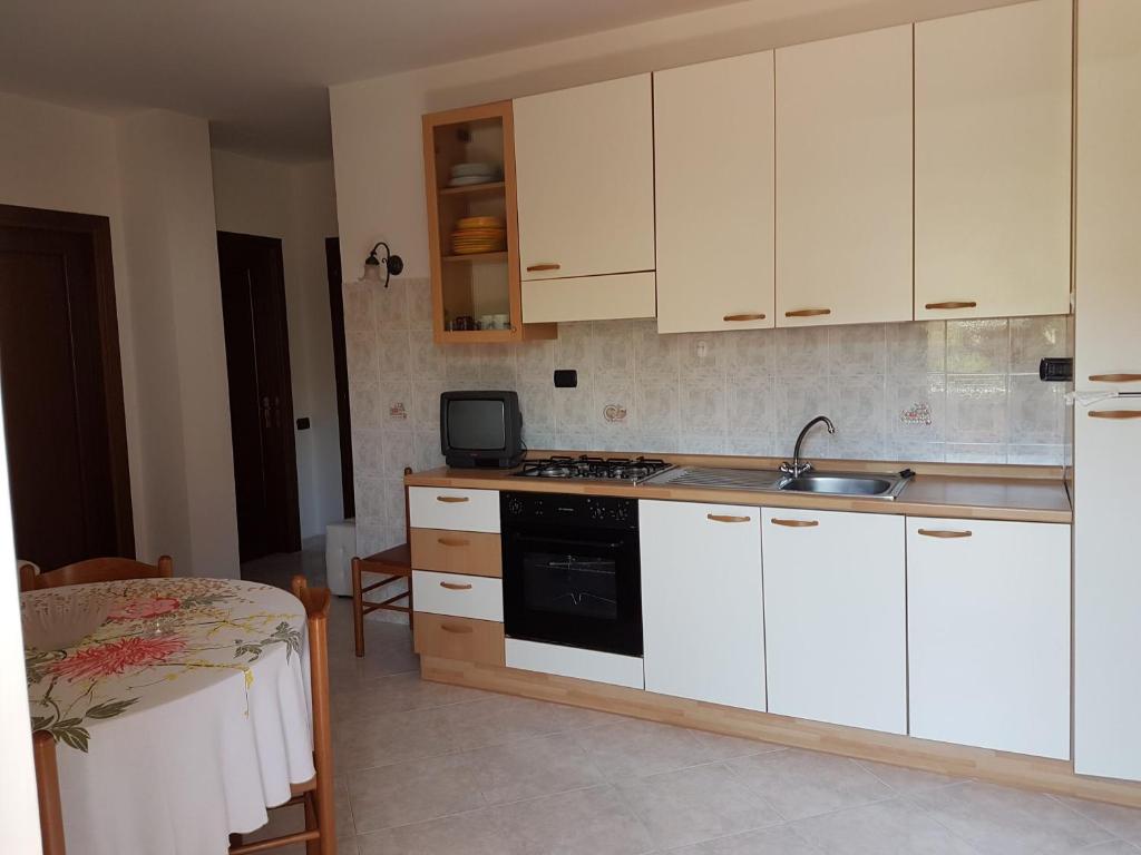 Kuchyň nebo kuchyňský kout v ubytování Hotel la Praia