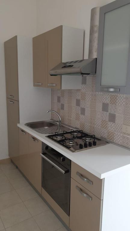 Kuchyň nebo kuchyňský kout v ubytování Hotel la Praia
