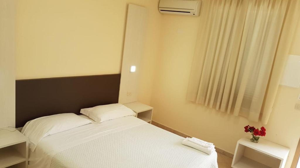 Postel nebo postele na pokoji v ubytování Hotel la Praia