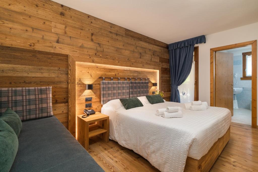 Albergo alla Postaにあるベッド