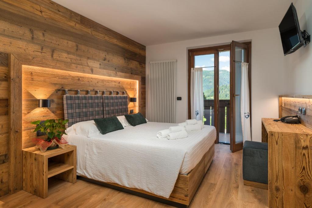Albergo alla Postaにあるベッド