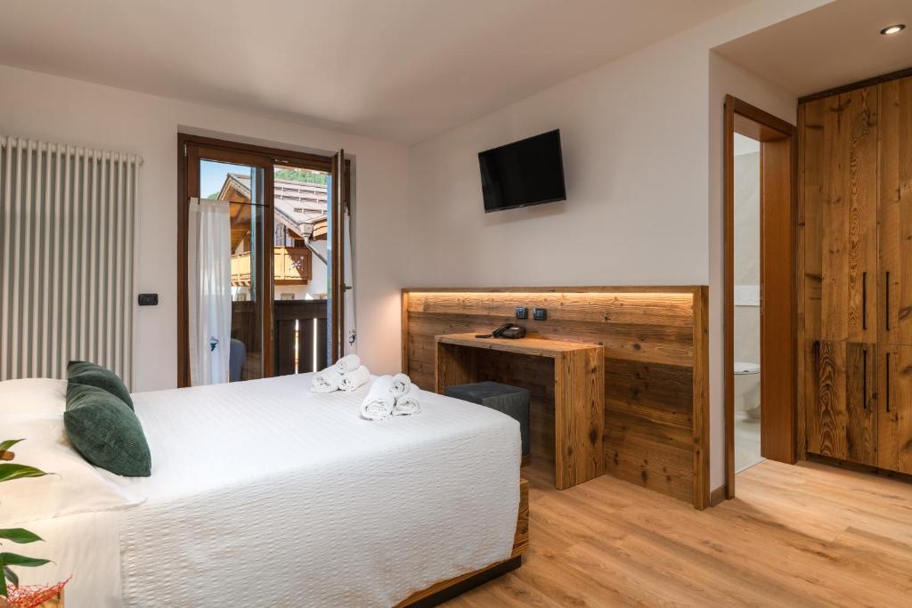 Albergo alla Postaにあるベッド