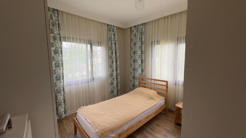Postel nebo postele na pokoji v ubytování Zeytin Dalı Villa