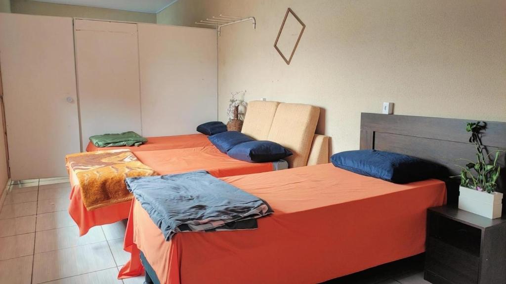Postel nebo postele na pokoji v ubytování Pousada Apucarana - Filial