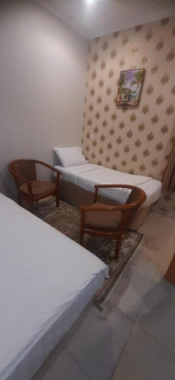 Postel nebo postele na pokoji v ubytování فندق رايد