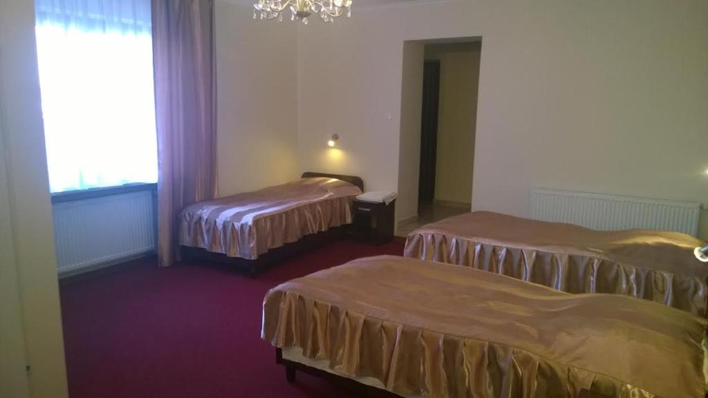 Postel nebo postele na pokoji v ubytování Hotel E7