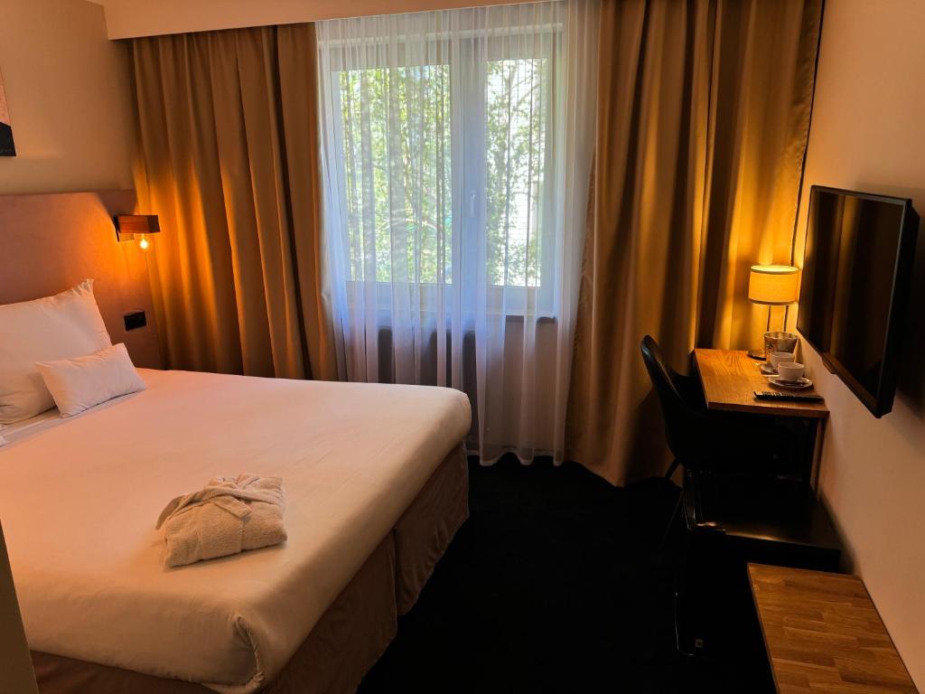 Postel nebo postele na pokoji v ubytování Amber Blue Wellness & SPA
