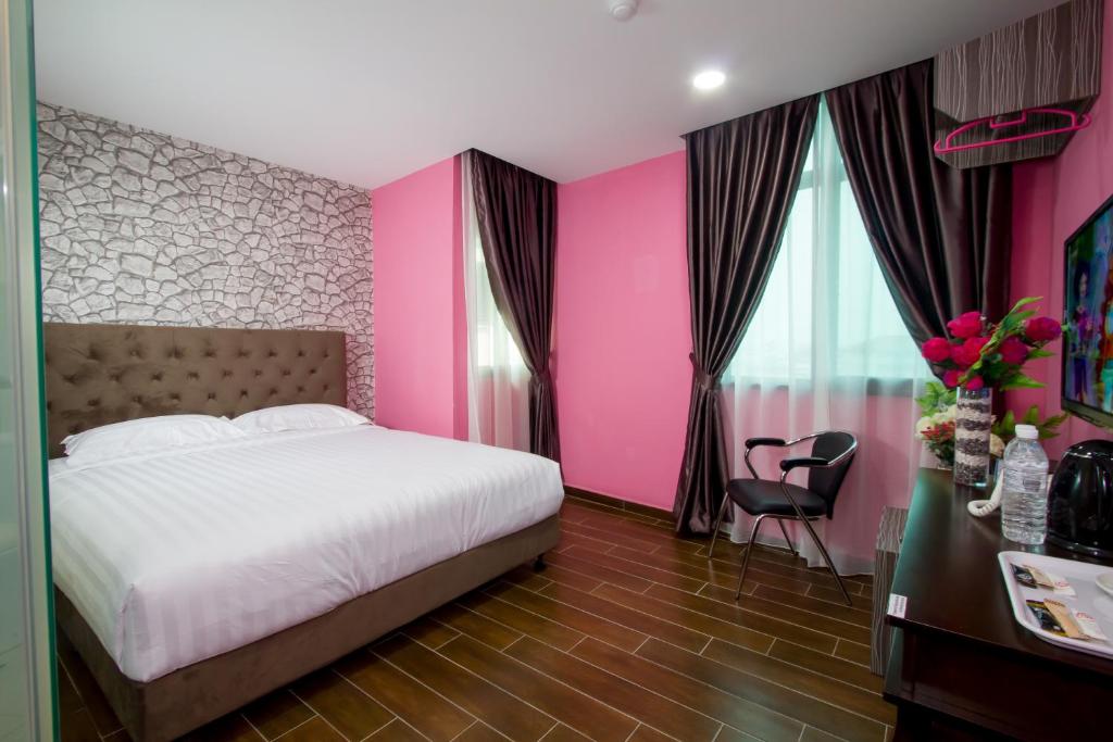 Postel nebo postele na pokoji v ubytování Elmark Hotel Johor