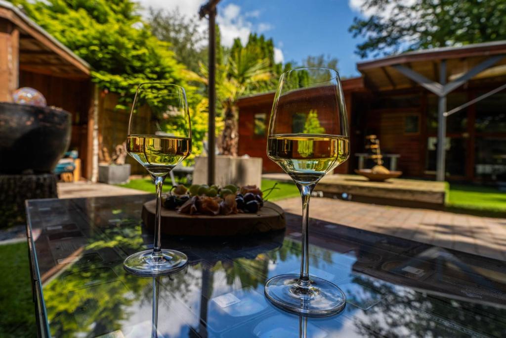 Zahrada ubytování Drents Genieten - Ericaheide met privé sauna en jacuzzi