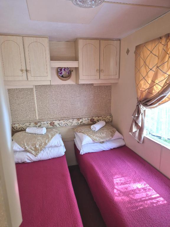 Postel nebo postele na pokoji v ubytování Vila Giruliai