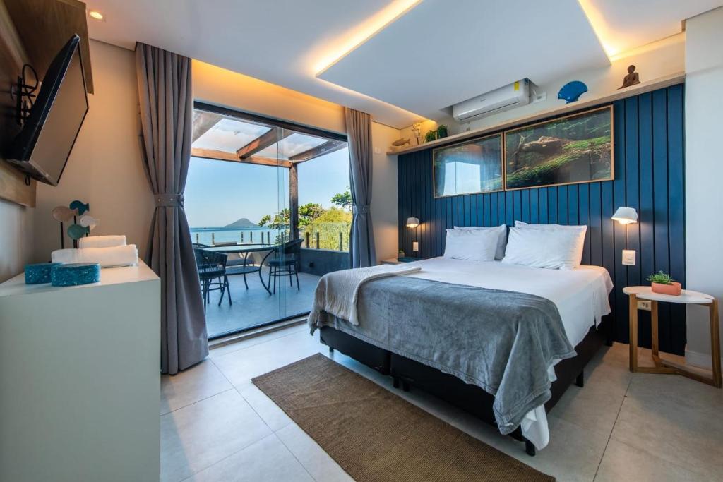 Cama ou camas em um quarto em Casatua Pousada