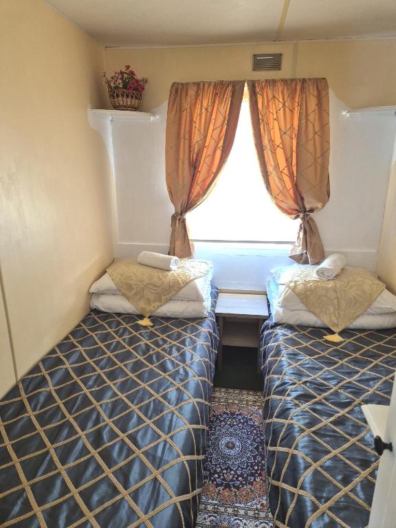 Postel nebo postele na pokoji v ubytování Vila Giruliai
