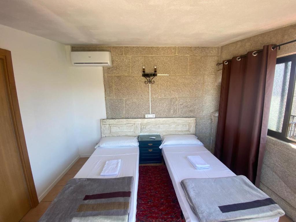 Postel nebo postele na pokoji v ubytování Albergue Villa San Clemente