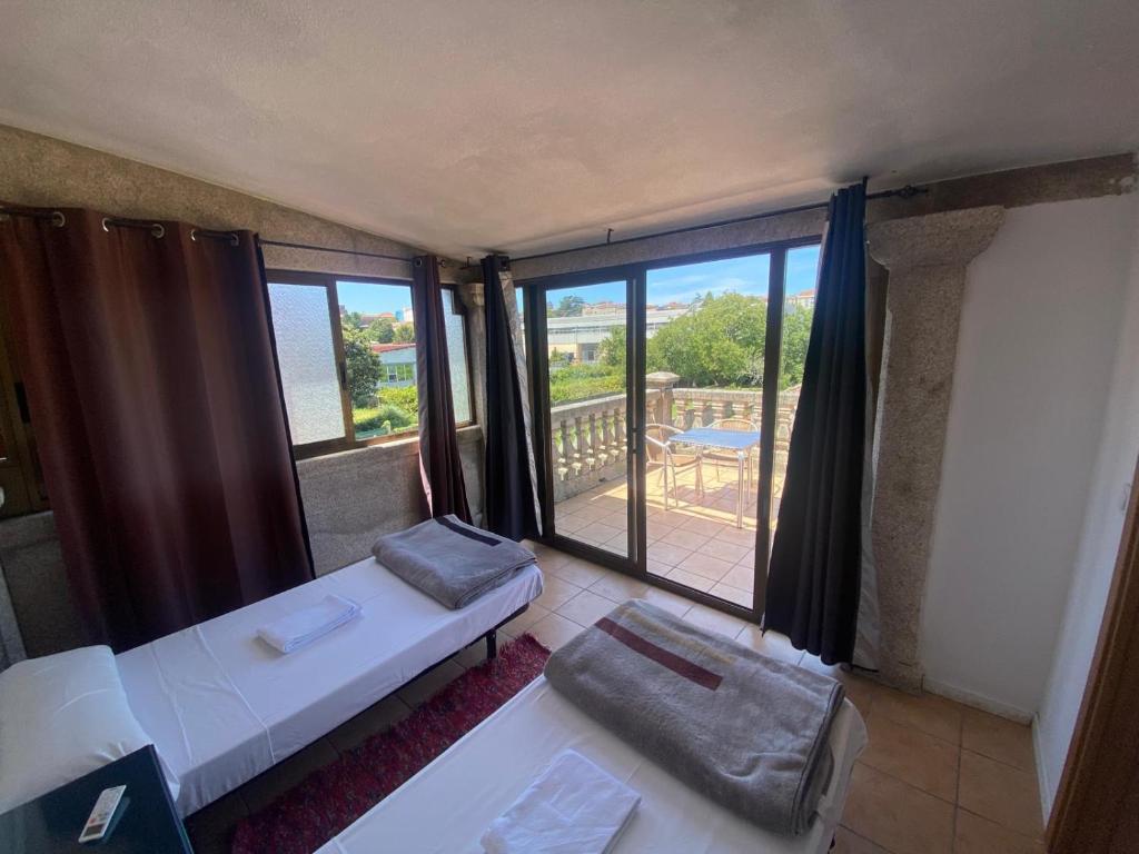Postel nebo postele na pokoji v ubytování Albergue Villa San Clemente
