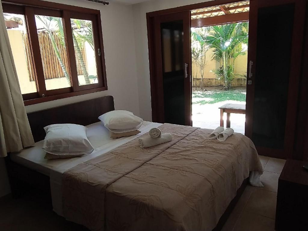 Ένα ή περισσότερα κρεβάτια σε δωμάτιο στο Pipa Beleza - Hospedagem Econômica