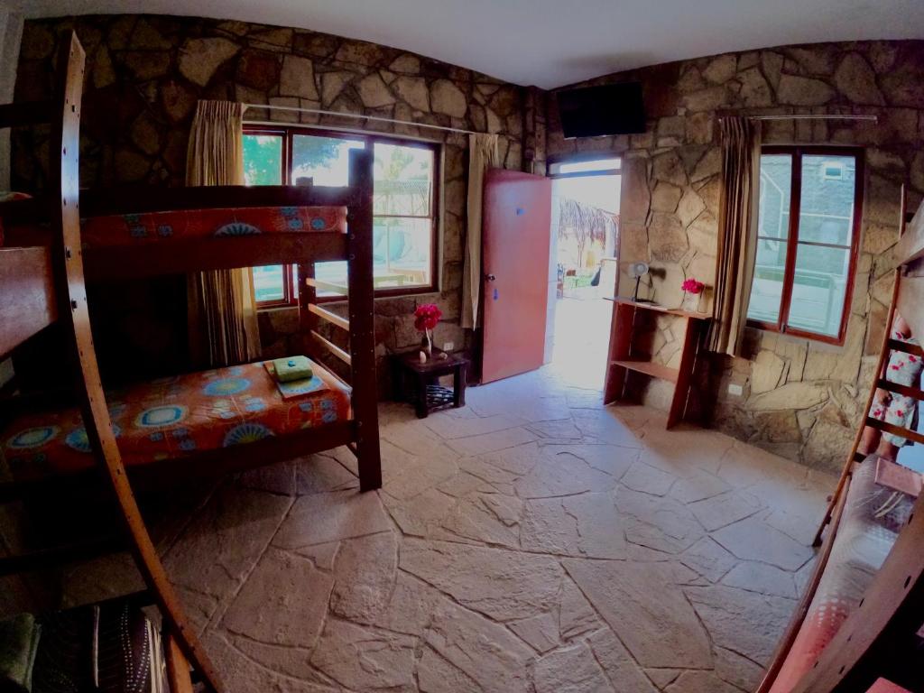 Postel nebo postele na pokoji v ubytování Stone House Mancora